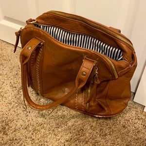 A tan leather purse